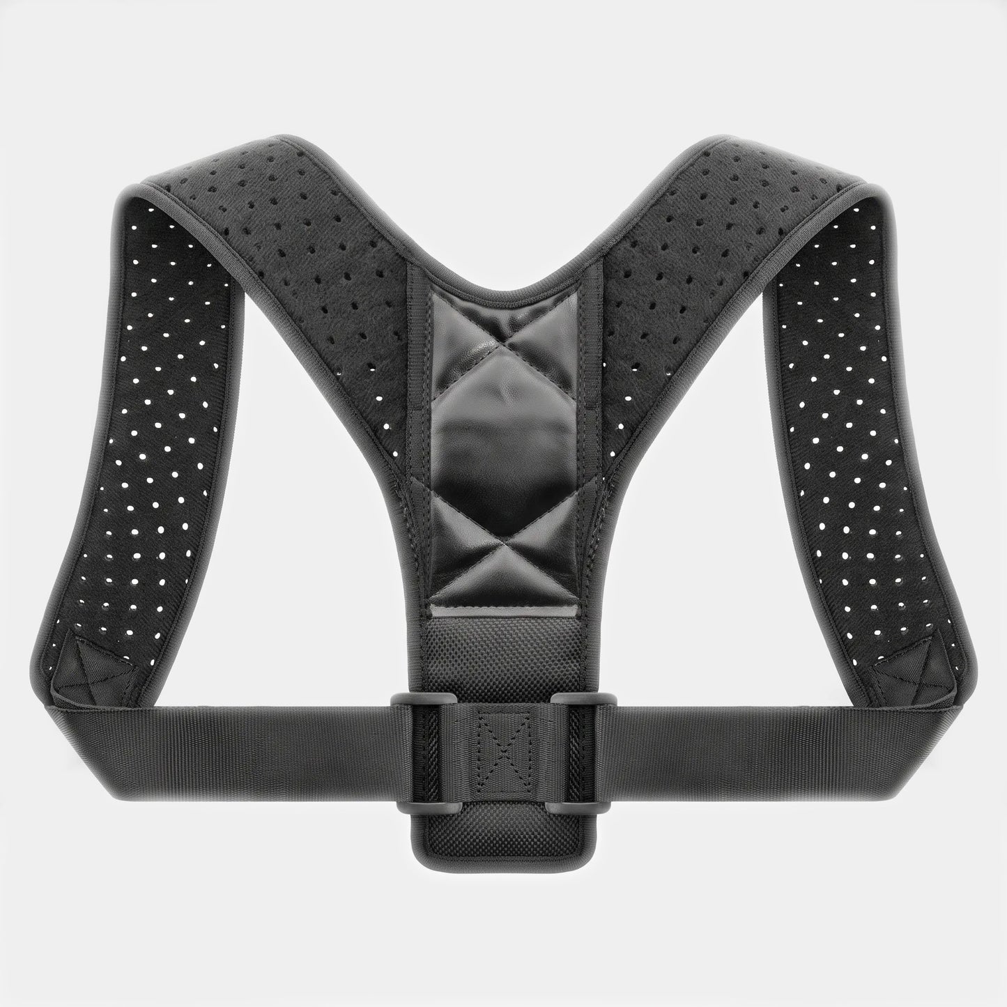 A black posture corrector harness with breathable perforated straps and a central padded support panel, shown against a light gray background.
