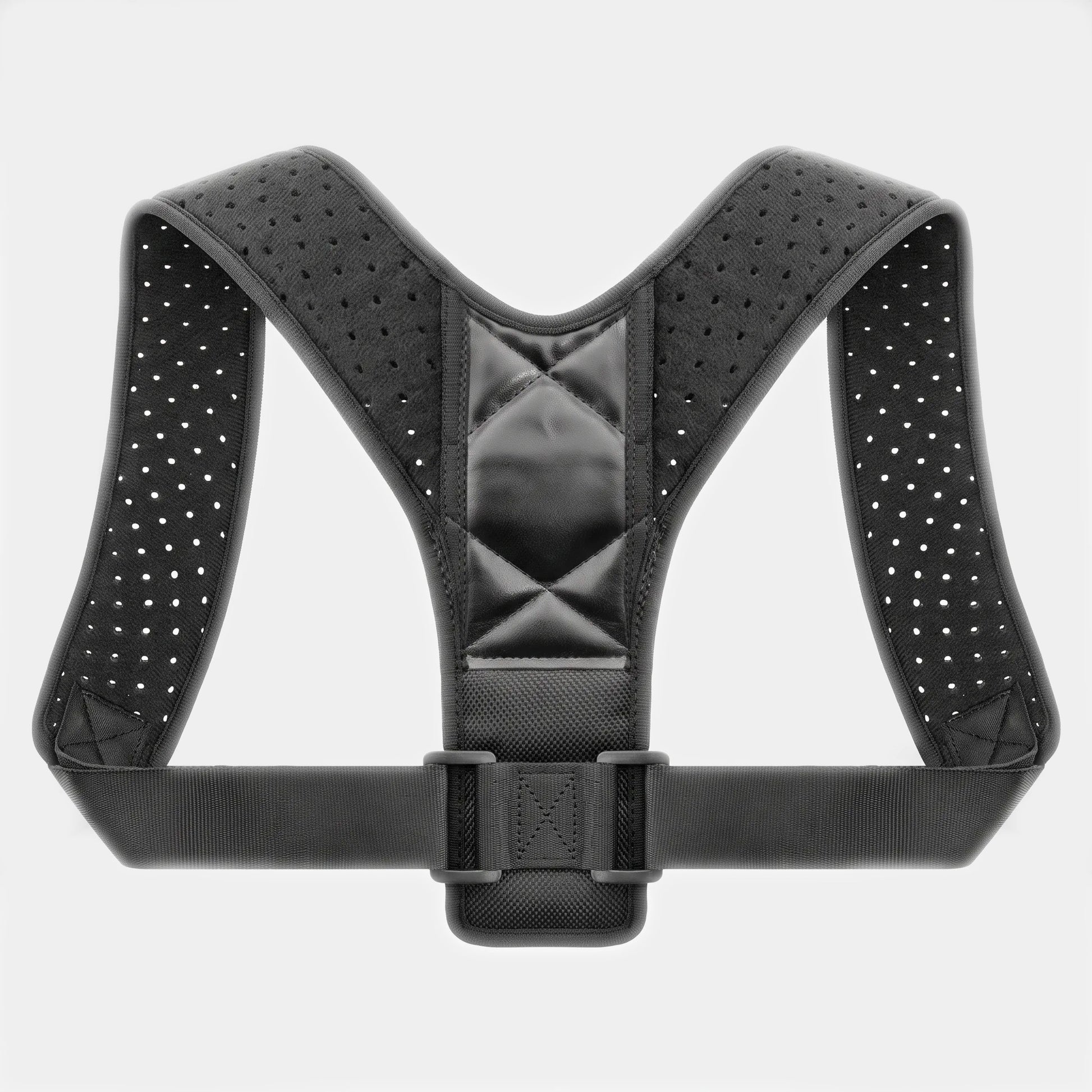 A black posture corrector harness with breathable perforated straps and a central padded support panel, shown against a light gray background.