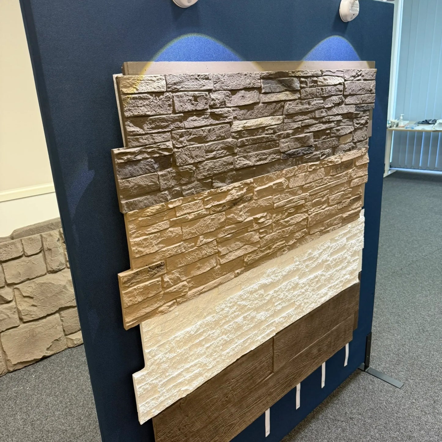 Polyurethane cover samples in various stone and wood finishes for customising the Premium Mobile Bar.